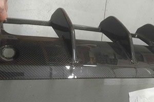 Cracked Aston Martin Vanquish S rear diffuser