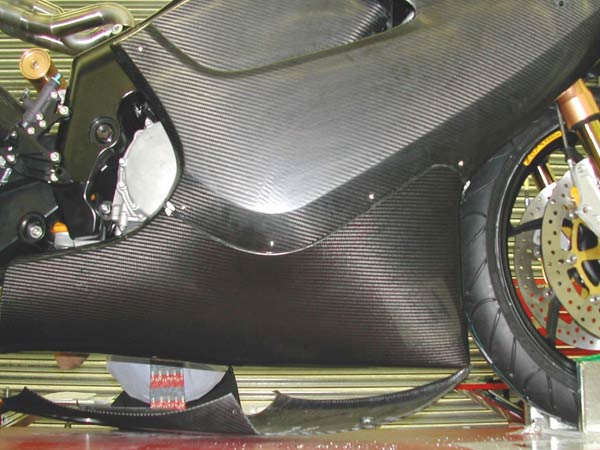 Close of of side fairing and belly pan fitted to the bike